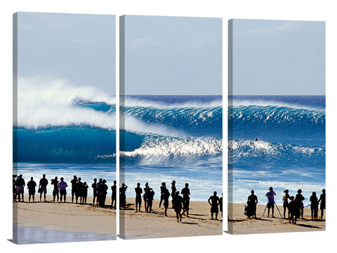 silhouetted onlookers watch big waves rolling in at Pipeline, no
