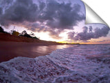 An ocean wave breaking onto the beach at Makena State Park, on the island of Maui in Hawaii.