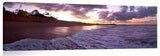 An ocean wave breaking onto the beach at Makena State Park, on the island of Maui in Hawaii.