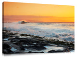 sunset over big surf at Keiki on Oahu's north shore.