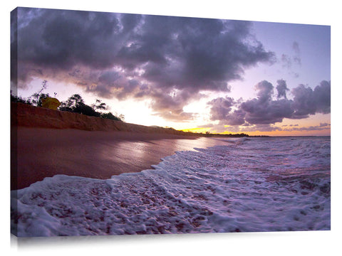 An ocean wave breaking onto the beach at Makena State Park, on the island of Maui in Hawaii.