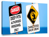 Dangerous surf warning signs at Pipeline on oahu's north shore.