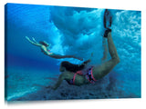 underwater view of girls swimming in the surf, north shore, Oahu