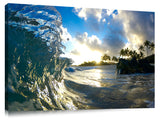 A wave breaking onto the beach during sunrise, on the north shore.