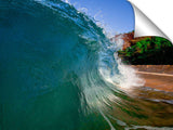 An ocean wave breaking onto the beach at Makena State Park, on the island of Maui in Hawaii.