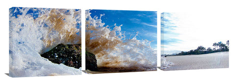 An ocean wave crashing against a rock, on the island of Oahu, Hawaii.