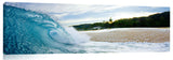 An ocean wave breaking onto the beach on the north shore.