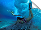 underwater view of girls swimming in the surf, north shore, Oahu