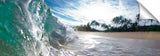 An ocean wave crashing against a rock, on the island of Oahu, Hawaii.