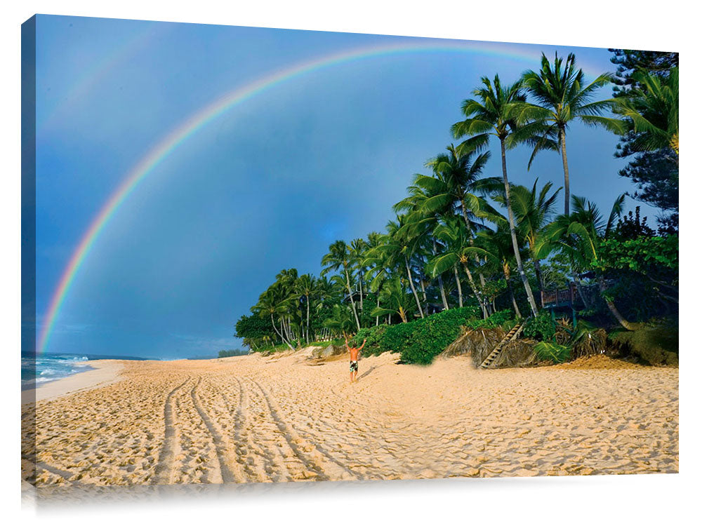 A huge raibow over the beach at worlfd famous Pipeline, on Oahu's north shore.