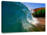 An ocean wave breaking onto the beach at Makena State Park, on the island of Maui in Hawaii.
