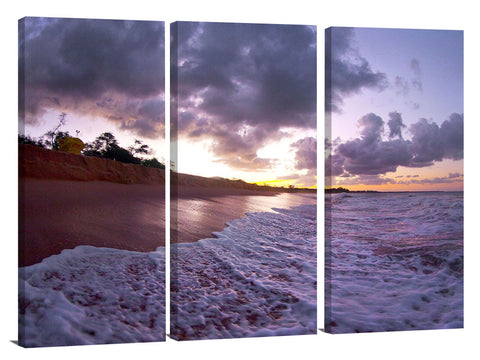 An ocean wave breaking onto the beach at Makena State Park, on the island of Maui in Hawaii.