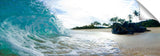 An ocean wave crashing against a rock, on the island of Oahu, Hawaii.