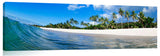 A wave washing onto the beach on the north shore.