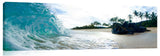 An ocean wave crashing against a rock, on the island of Oahu, Hawaii.