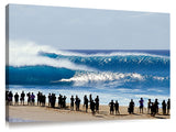 silhouetted onlookers watch big waves rolling in at Pipeline, no