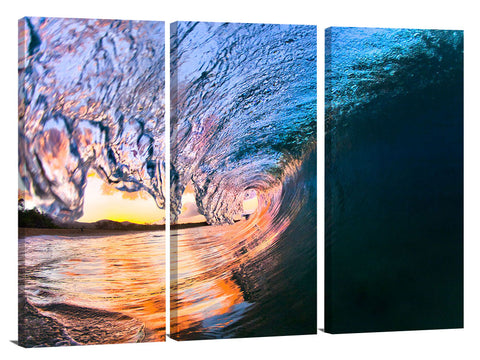 An ocean wave breaking onto the beach at Makena State Park, on the island of Maui in Hawaii.