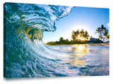 An ocean wave breaking onto the beach during sunrise, on the north shore of Oahu.