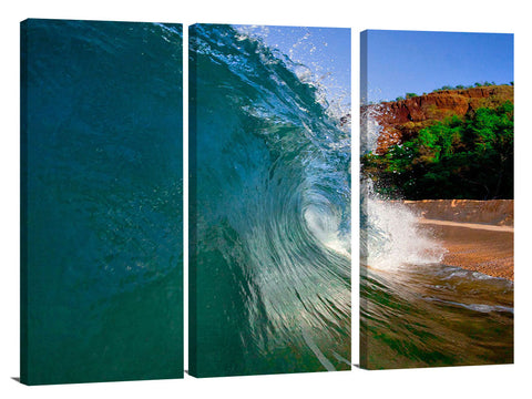 An ocean wave breaking onto the beach at Makena State Park, on the island of Maui in Hawaii.