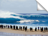 silhouetted onlookers watch big waves rolling in at Pipeline, no