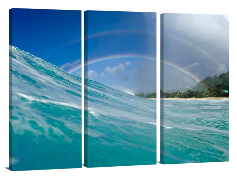 A rainbow over the surf at Pupukea, on the north shore of Oahu, Hawaii